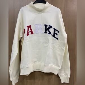 Cream Sweatshirt with Red and Blue Lettering